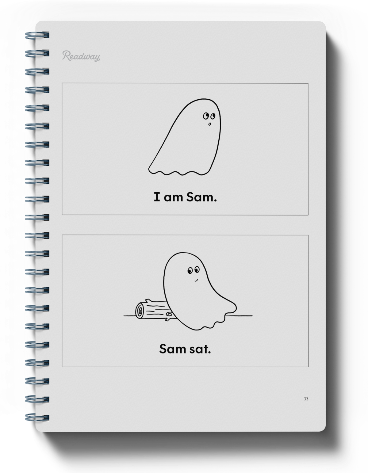 A spiral-bound children's workbook shown on a white background. The open page features two cartoon ghost illustrations with text reading "I am Sam" and "Sam sat."